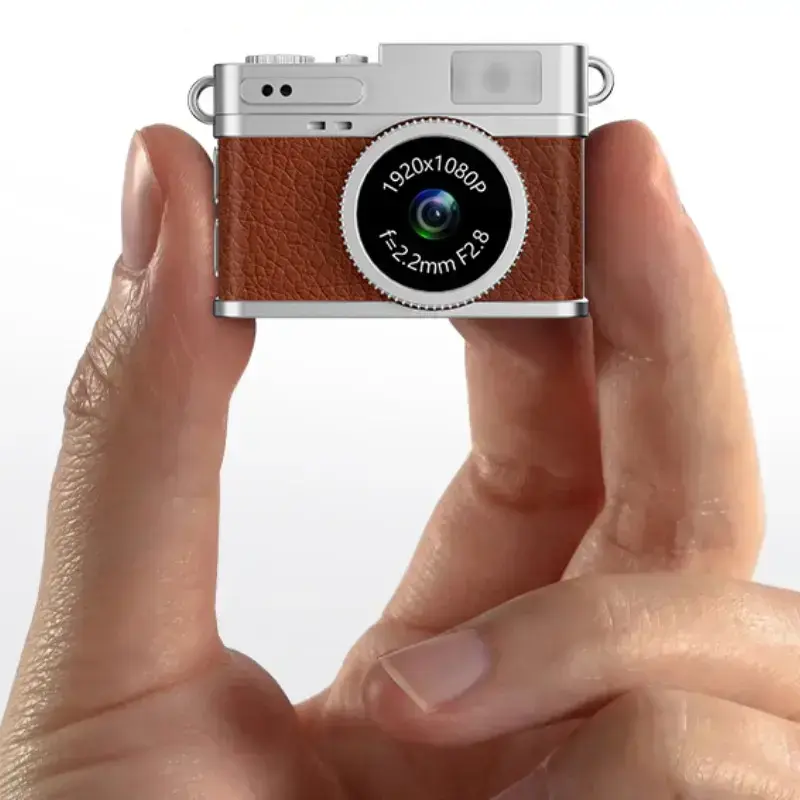 Mini brown and silver digital camera with a vintage camera design