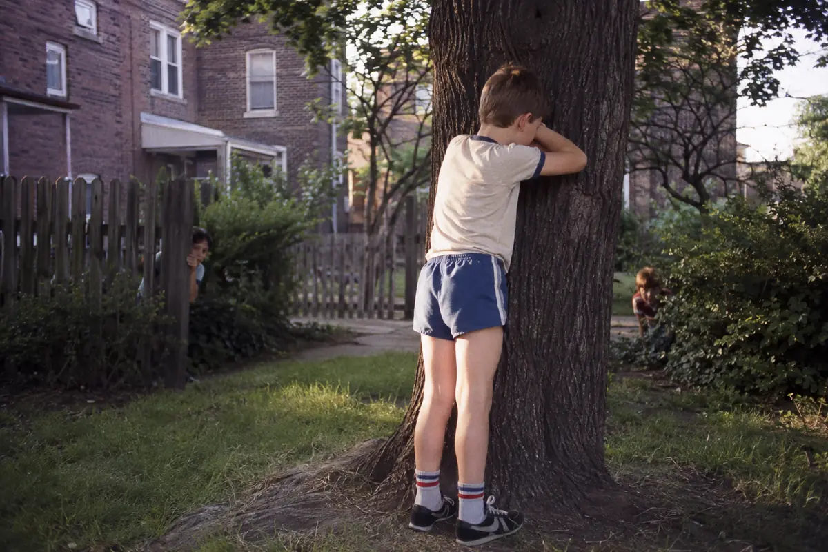 Children playing hide-and-seek, one of the games played before smartphones