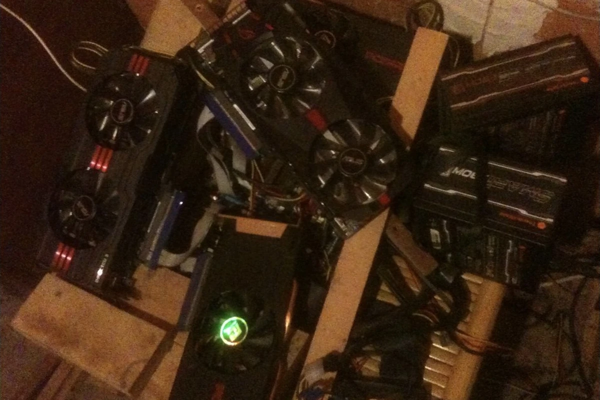 My later open mining rig with several graphics cards, power supplies and cables.