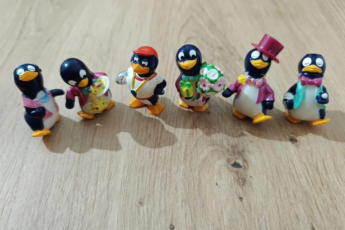 Six Kinder Peppy Pingo Party penguin figures from 1994 in colourful outfits